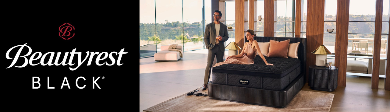 Beautyrest Black logo on left side, image of well-dressed couple in a luxurious bedroom with large windows standing and sitting on a Black mattress, labor day sale graphic on the right side saying get up to $1200 off Beautyrest Black and adjustable base
