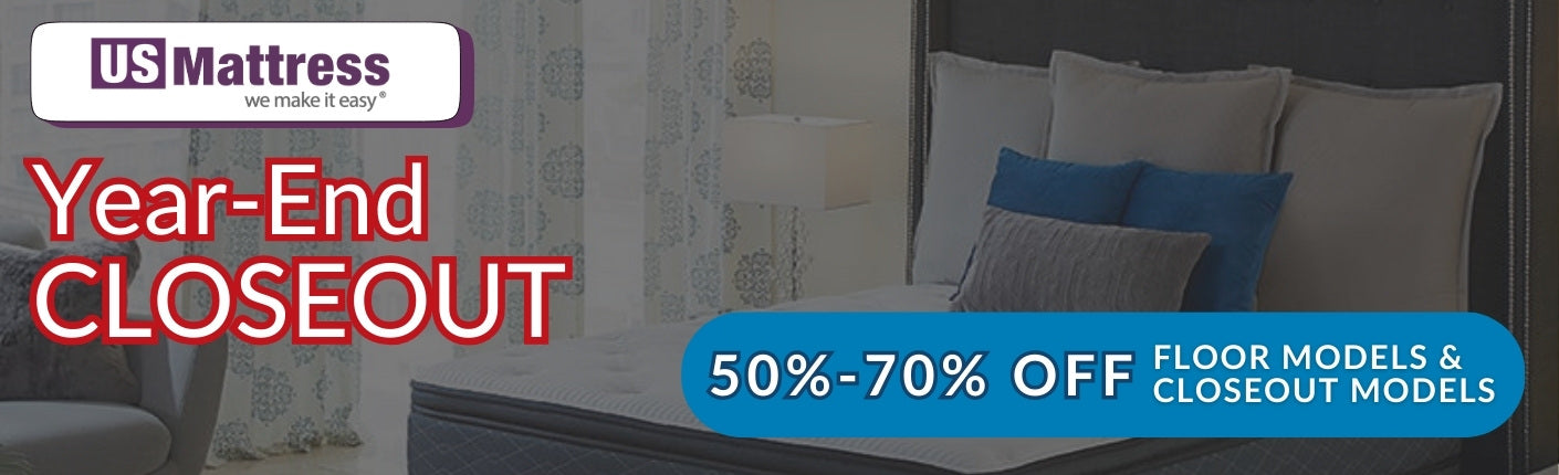 US Mattress year-end closeout advertisement with a bed and pillows in the background. 50% to 70% off floor models and closeout models.