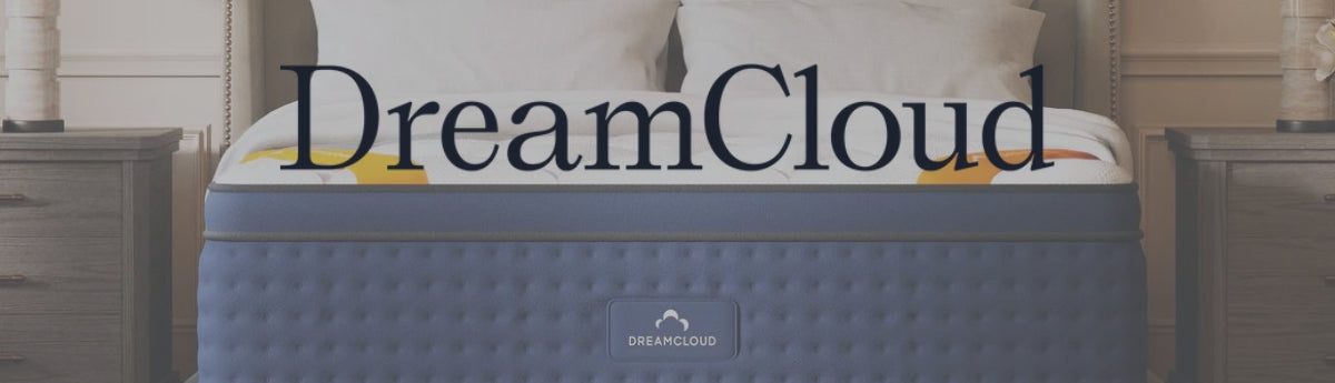 Large Dreamcloud logo over an image of a Dreamcloud mattress which is blue with a white top